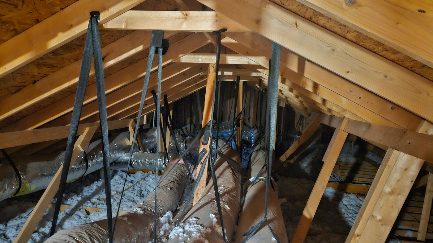 Insulated flexible ductwork in attic connected to heating system